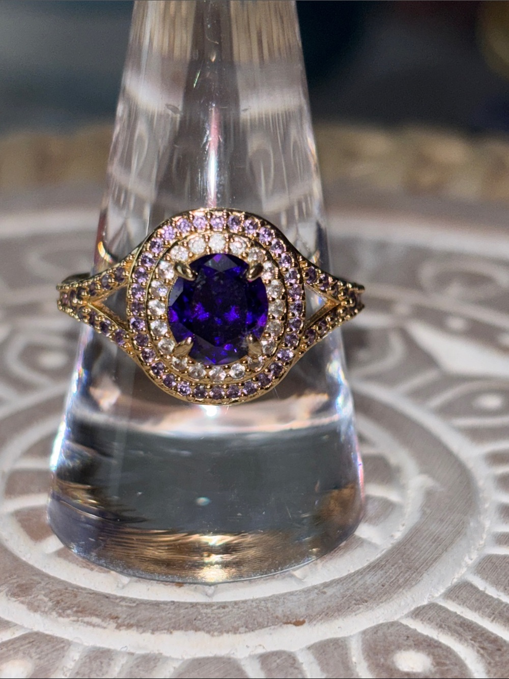 Gold Ring with Deep Purple Center Stone and Pavé Halo